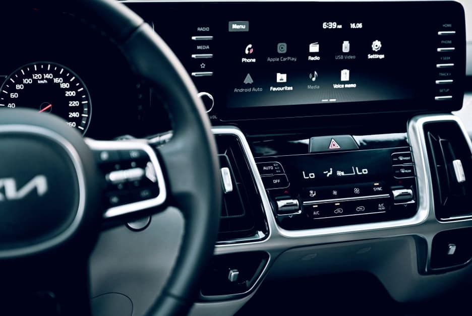 Editorial tech photograph illustrating: What Actually Sets Android Auto and CarPlay Apart