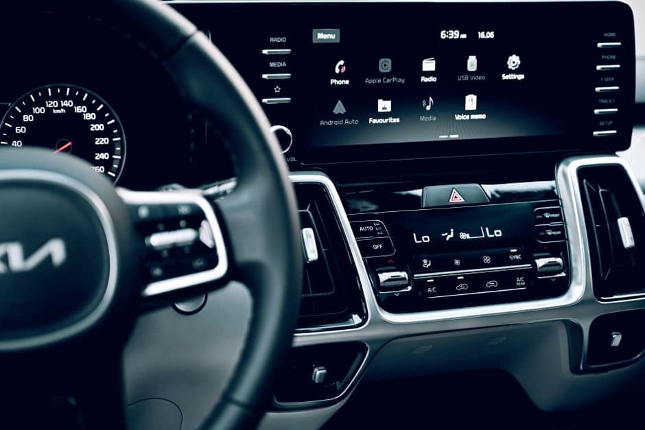 Editorial tech photograph illustrating: What Actually Sets Android Auto and CarPlay Apart